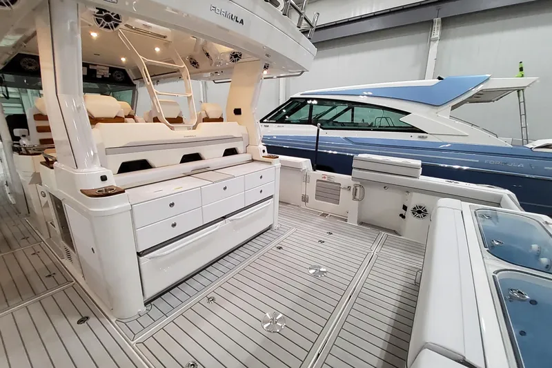  Yacht Photos Pics 2026 Formula 457 Center Console Fish boat interior with seating and storage.