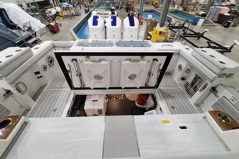  Yacht Photos Pics 2026 Formula 457 Center Console Fish boat interior with open hatch, showcasing storage and equipment.