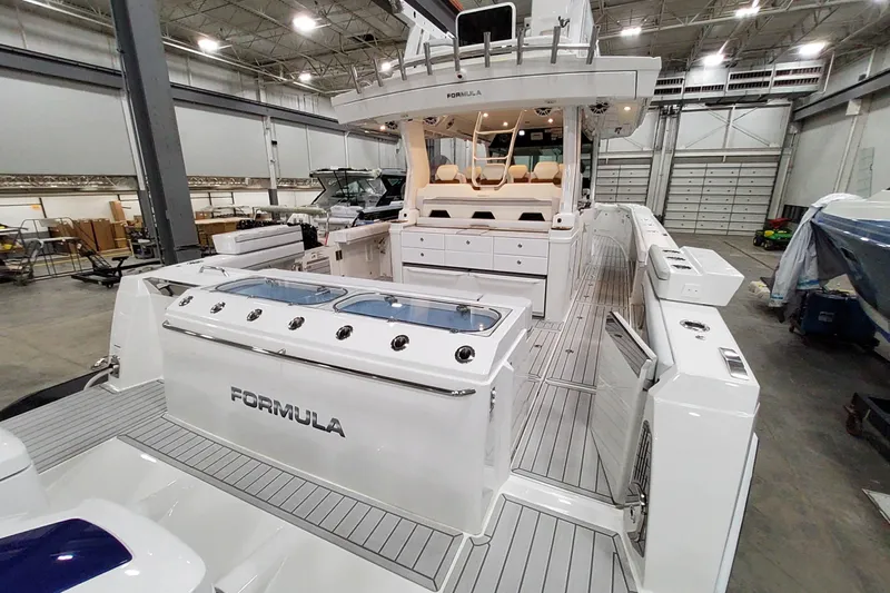  Yacht Photos Pics 2026 Formula 457 Center Console Fish boat in a spacious indoor showroom.