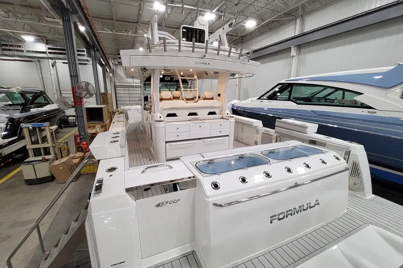  Yacht Photos Pics 2026 Formula 457 Center Console Fish boat in a showroom, showcasing sleek design and features.