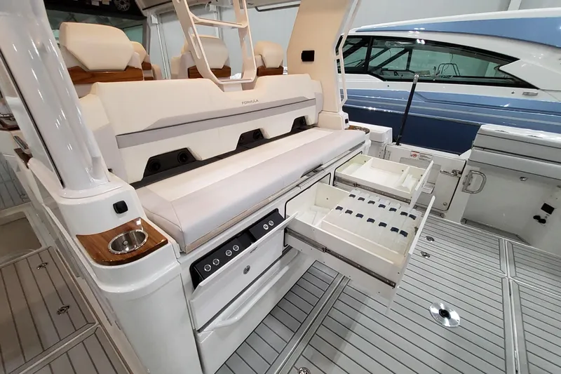  Yacht Photos Pics 2026 Formula 457 Center Console Fish boat with open storage drawers and seating area.