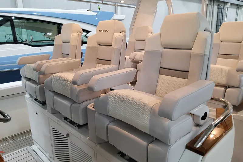  Yacht Photos Pics Luxurious seating on 2026 Formula 457 Center Console Fish boat, featuring plush, ergonomic design.