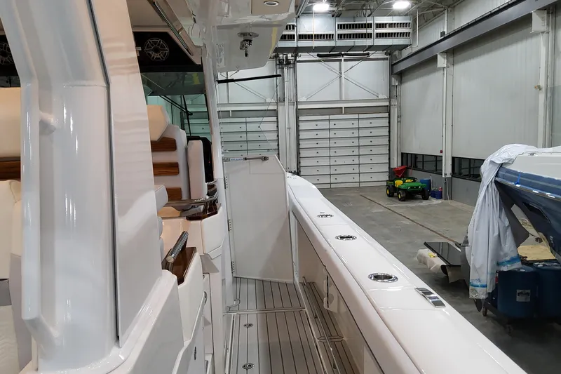  Yacht Photos Pics 2026 Formula 457 Center Console Fish boat interior in a spacious warehouse.