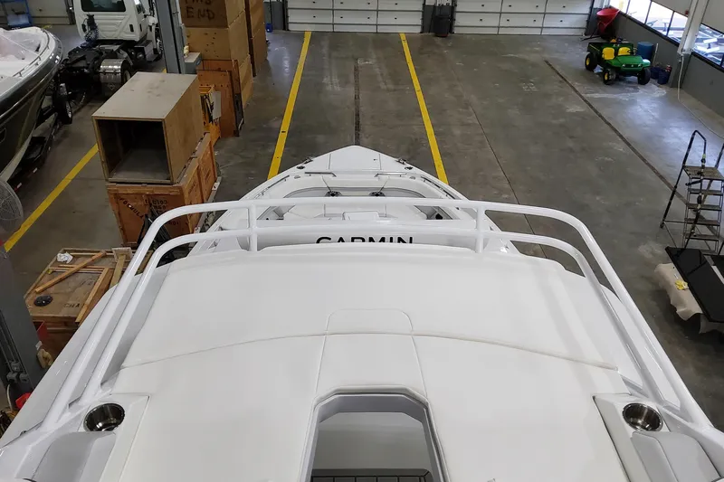  Yacht Photos Pics 2026 Formula 457 Center Console Fish boat in a spacious indoor storage facility.