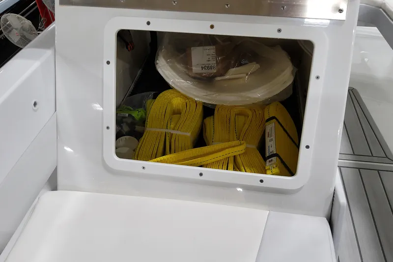 Yacht Photos Pics Storage compartment in 2026 Formula 457 Center Console Fish boat with yellow straps and equipment.