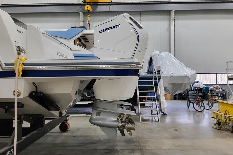  Yacht Photos Pics 2026 Formula 457 Center Console Fish boat in a workshop with Mercury engine.