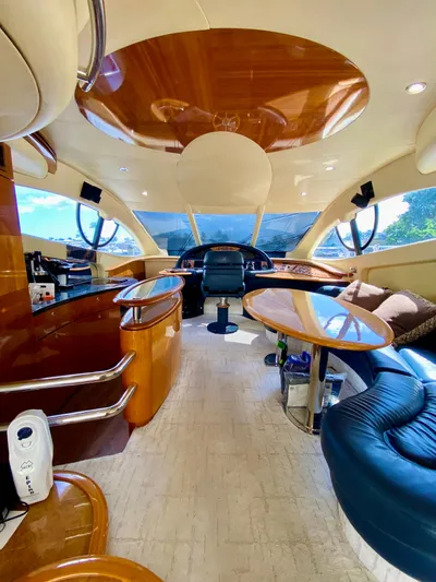 Last Minute Yacht Photos Pics Luxurious interior of a 2002 Azimut 55 yacht with elegant wood finishes.