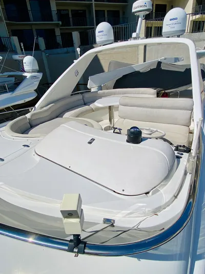 Last Minute Yacht Photos Pics 2002 Azimut 55 yacht with sleek white deck and modern seating.