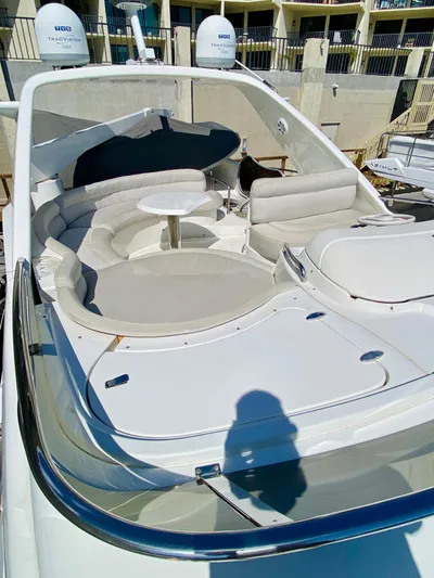 Last Minute Yacht Photos Pics 2002 Azimut 55 yacht with spacious outdoor seating and table.