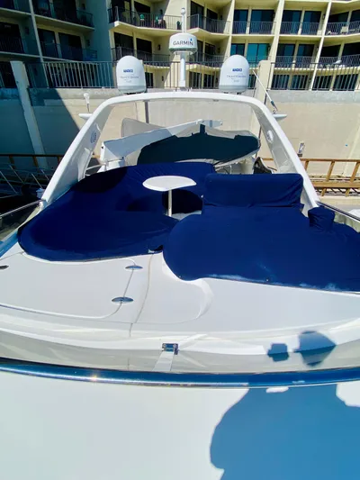 Last Minute Yacht Photos Pics Azimut 55 yacht, 2002 model, with blue sunbathing cushions and modern design.