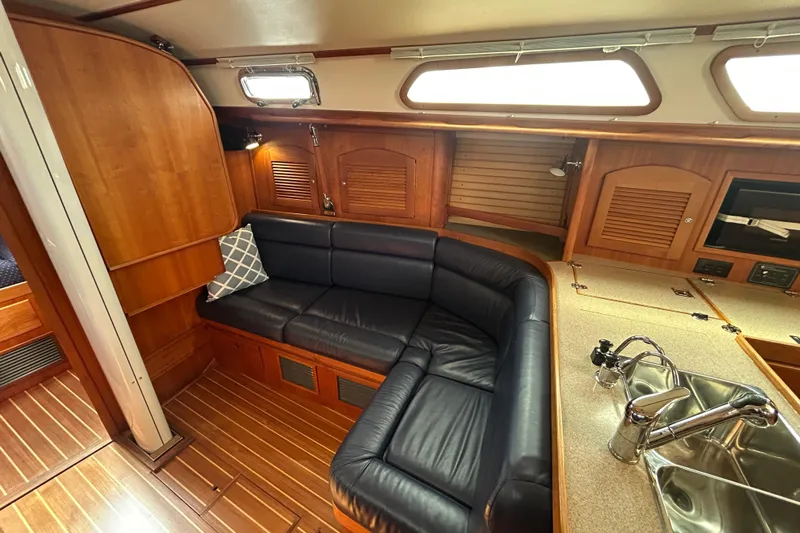 Indigo Yacht Photos Pics Interior of 2002 Sabre 362 yacht with leather seating and wooden cabinetry.