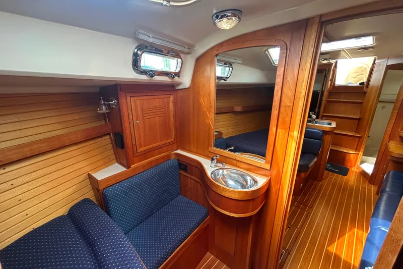 Indigo Yacht Photos Pics Interior of 2002 Sabre 362 sailboat with wood finish and cozy seating area.