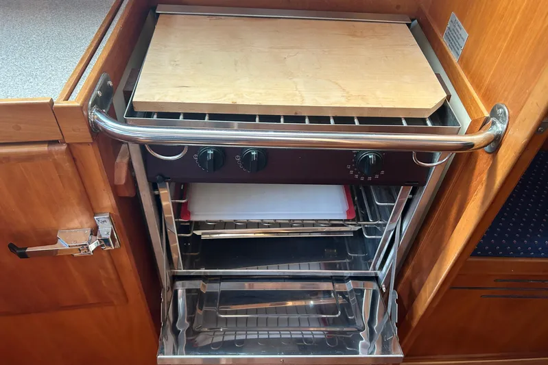 Indigo Yacht Photos Pics 2002 Sabre 362 yacht kitchen with built-in oven and wooden cutting board.