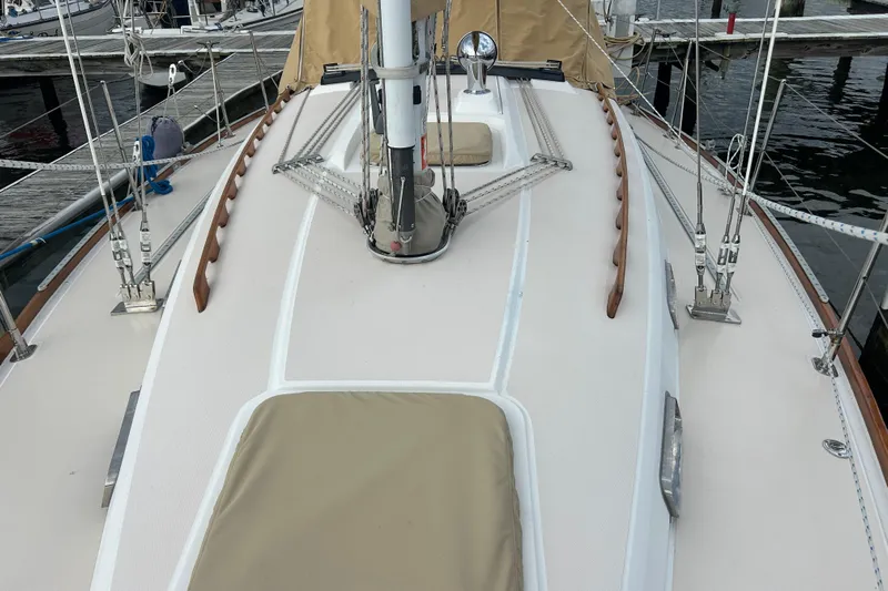 Indigo Yacht Photos Pics 2002 Sabre 362 sailboat deck with rigging and tan covers at marina.