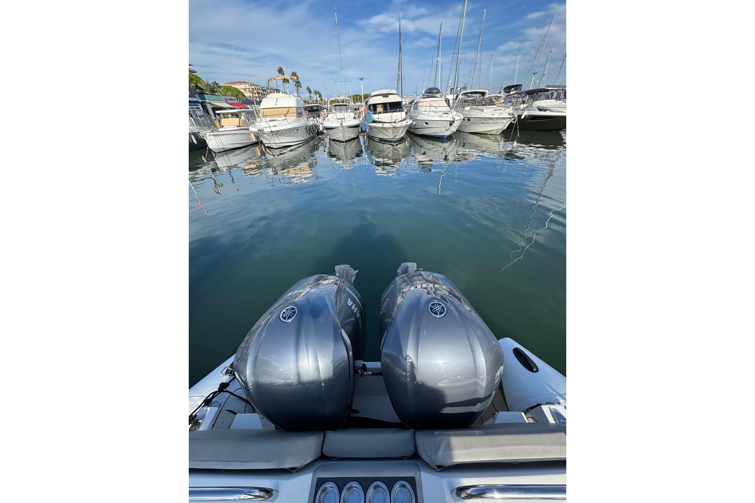 Agapi 950 boat with dual engines docked in a marina, 2019 model.