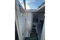 Interior of 2019 Agapi 950 boat with modern design and skylight.