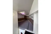 Interior cabin of 2019 Agapi 950 boat with cozy sleeping area.