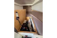 Interior view of 2019 Agapi 950 boat with open storage compartment.