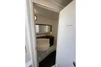 Compact bathroom in 2019 Agapi 950 boat with toilet and modern sink.