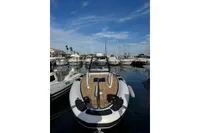 2019 Agapi 950 boat docked in a marina under a clear blue sky.