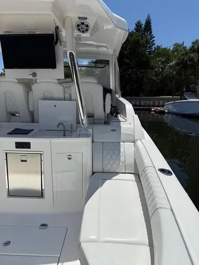  Yacht Photos Pics 2023 Regal 33 SAV boat interior with sleek white seating and modern amenities.