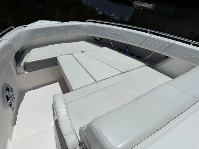 Yacht Photos Pics 2023 Regal 33 SAV boat with spacious white seating area.