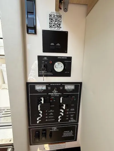  Yacht Photos Pics 2023 Regal 33 SAV control panel with switches and level monitor.