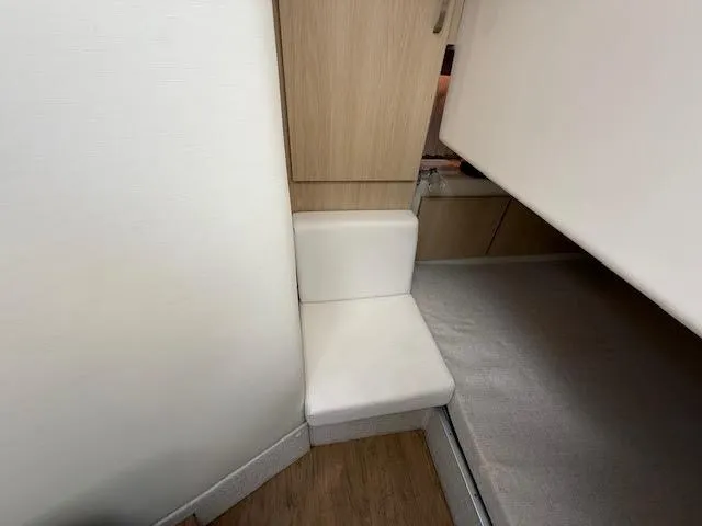  Yacht Photos Pics 2023 Regal 33 SAV interior with compact seating and modern design elements.