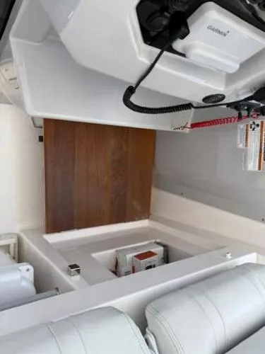 Yacht Photos Pics 2023 Regal 33 SAV interior with white seating and wooden accents.