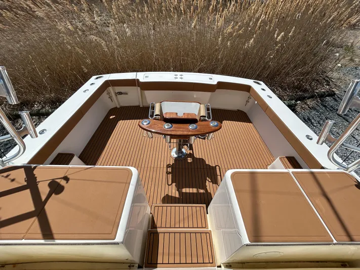 No Slack Yacht Photos Pics 2002 Albemarle 410 Express Fisherman boat deck with seating and fishing equipment.