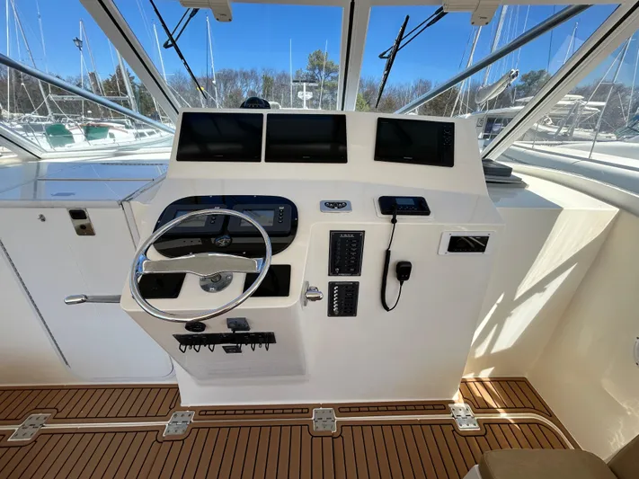 No Slack Yacht Photos Pics 2002 Albemarle 410 Express Fisherman helm with modern controls and navigation screens.