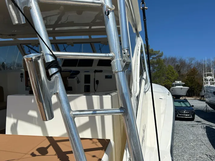 No Slack Yacht Photos Pics Albemarle 410 Express Fisherman 2002 boat ladder and cockpit, parked outdoors.