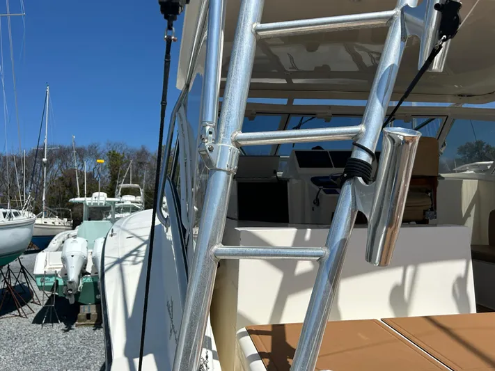 No Slack Yacht Photos Pics 2002 Albemarle 410 Express Fisherman boat with ladder and cockpit view.
