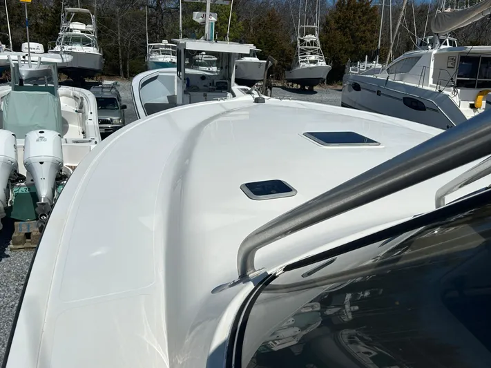 No Slack Yacht Photos Pics 2002 Albemarle 410 Express Fisherman boat deck with sleek design and multiple hatches.