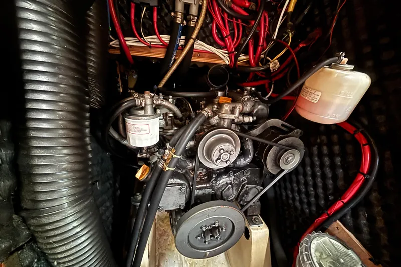 A Domani Yacht Photos Pics Engine compartment of a 2002 Beneteau Oceanis 411 sailboat, showing detailed wiring and components.