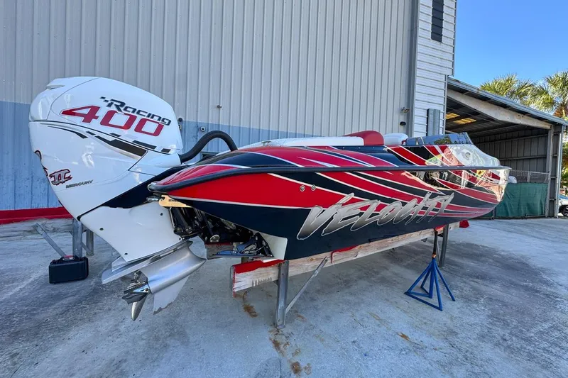  Yacht Photos Pics 2022 Velocity 290sc speedboat with Mercury Racing 400 engine, vibrant red and black design.