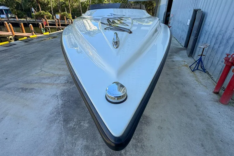  Yacht Photos Pics Front view of a 2022 Velocity 290sc boat on a concrete surface.