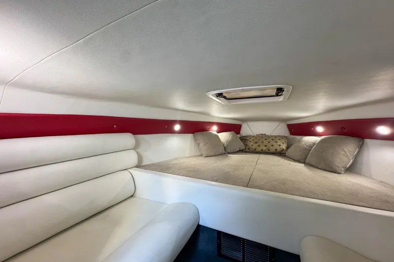  Yacht Photos Pics 2022 Velocity 290sc cabin interior with cozy seating and ambient lighting.