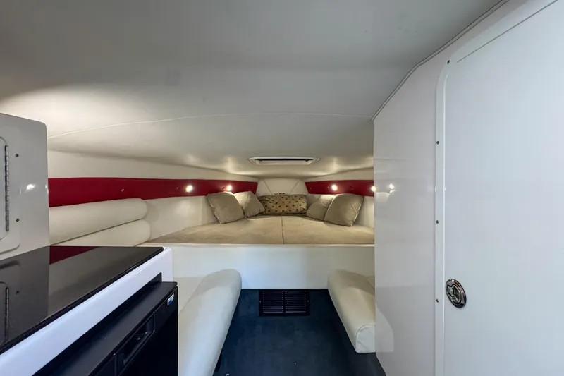  Yacht Photos Pics Interior cabin of 2022 Velocity 290sc boat with cozy seating and cushions.