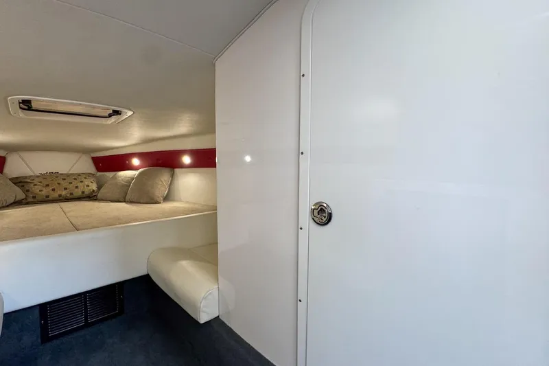  Yacht Photos Pics 2022 Velocity 290sc cabin interior with cozy bed and modern design.