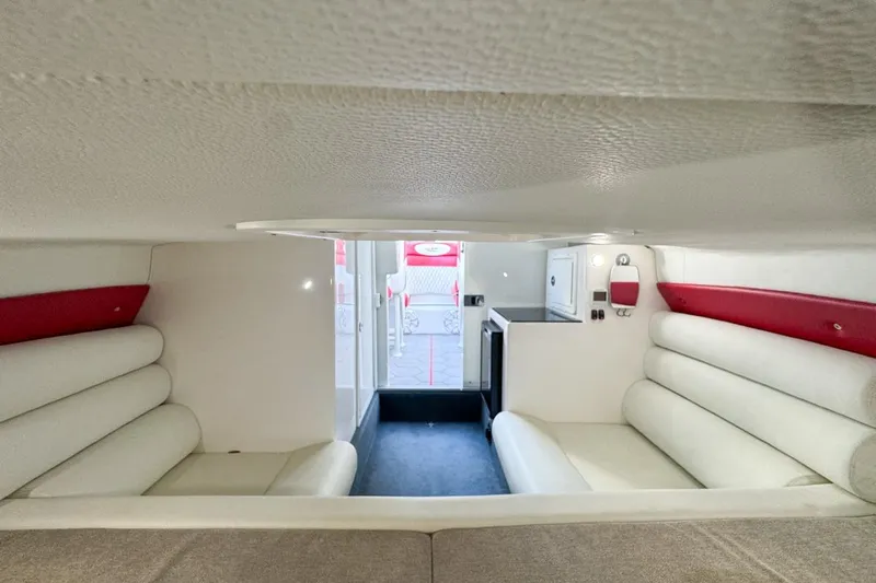  Yacht Photos Pics Interior of 2022 Velocity 290sc boat with white and red seating, compact design.
