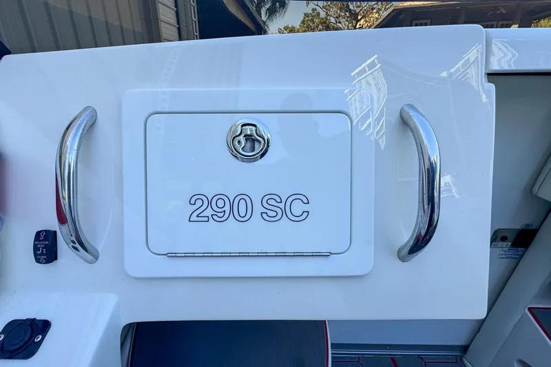  Yacht Photos Pics 2022 Velocity 290SC boat compartment with chrome handles and lock.