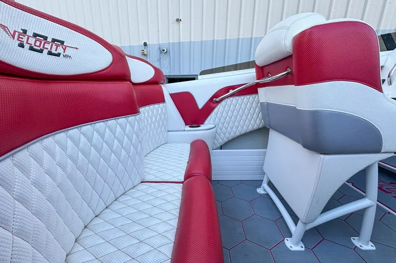  Yacht Photos Pics Red and white interior of 2022 Velocity 290sc boat with quilted seating.