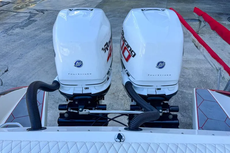  Yacht Photos Pics Twin outboard engines on a 2022 Velocity 290sc boat, featuring four-stroke technology.