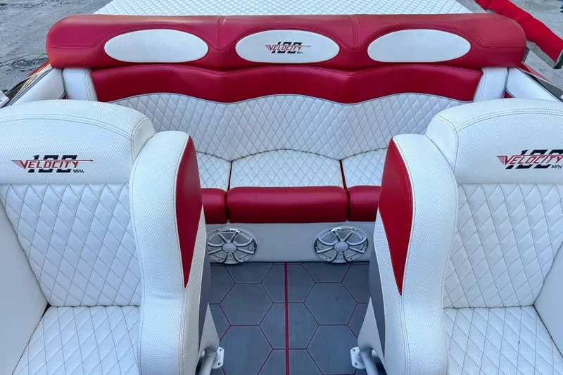  Yacht Photos Pics 2022 Velocity 290sc boat interior with red and white diamond-stitched seating.