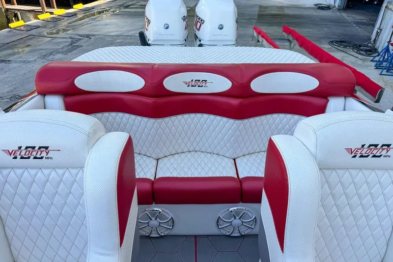  Yacht Photos Pics 2022 Velocity 290sc boat interior with red and white seating, docked with twin engines.