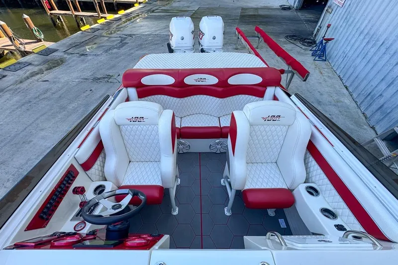  Yacht Photos Pics 2022 Velocity 290sc boat interior with red and white seating, docked at marina.