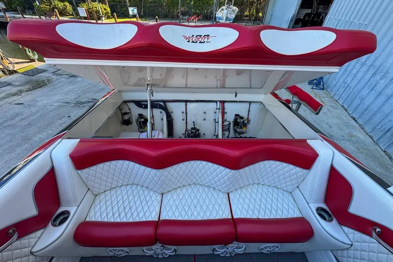  Yacht Photos Pics Red and white seating on 2022 Velocity 290sc boat, open engine compartment.