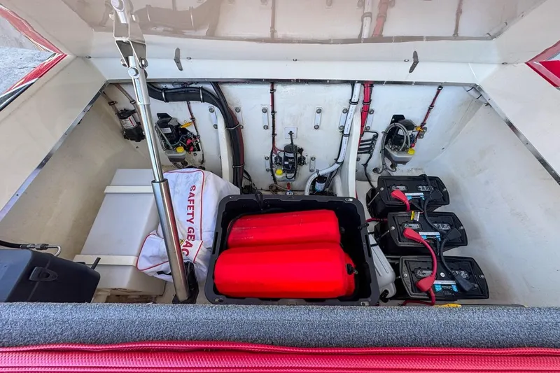  Yacht Photos Pics 2022 Velocity 290sc boat engine compartment with batteries and safety gear.