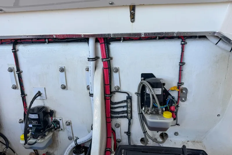  Yacht Photos Pics Engine compartment of 2022 Velocity 290sc boat with wiring and components.